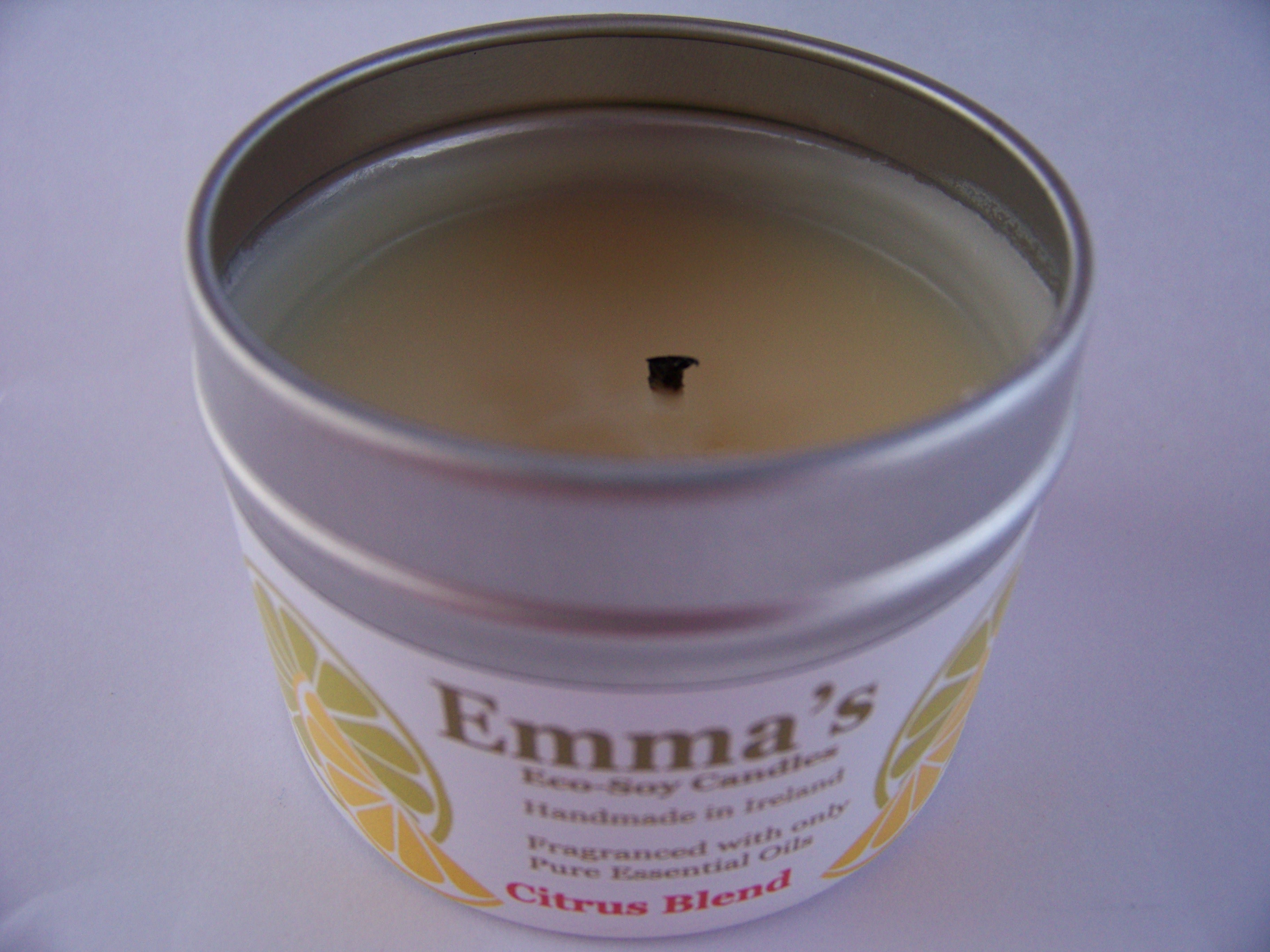Emma's So Naturals Candle with wick correctly trimmed.